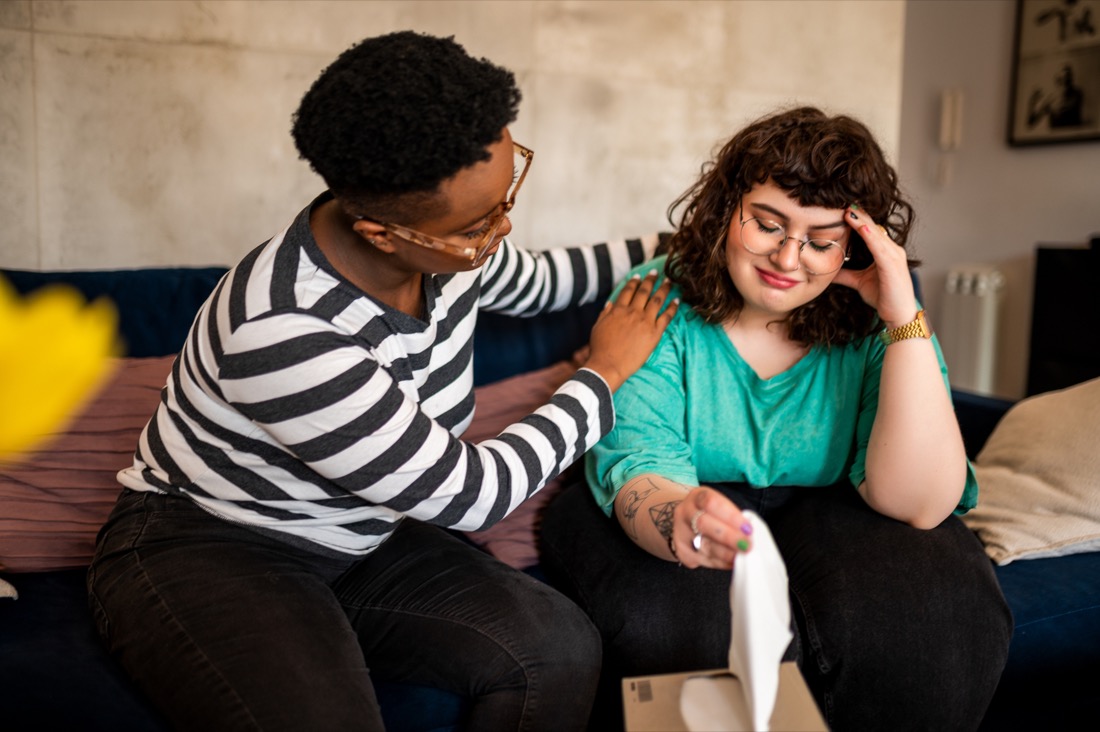 A person providing supportive care during a conversation.