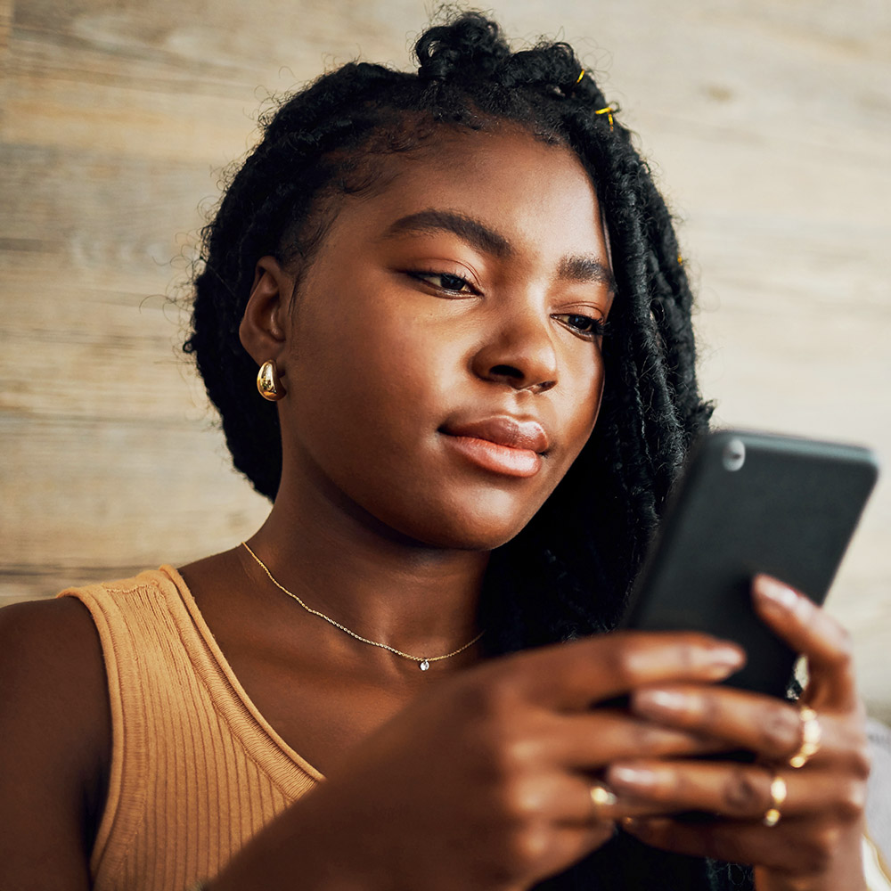 A woman using her mobile phone.